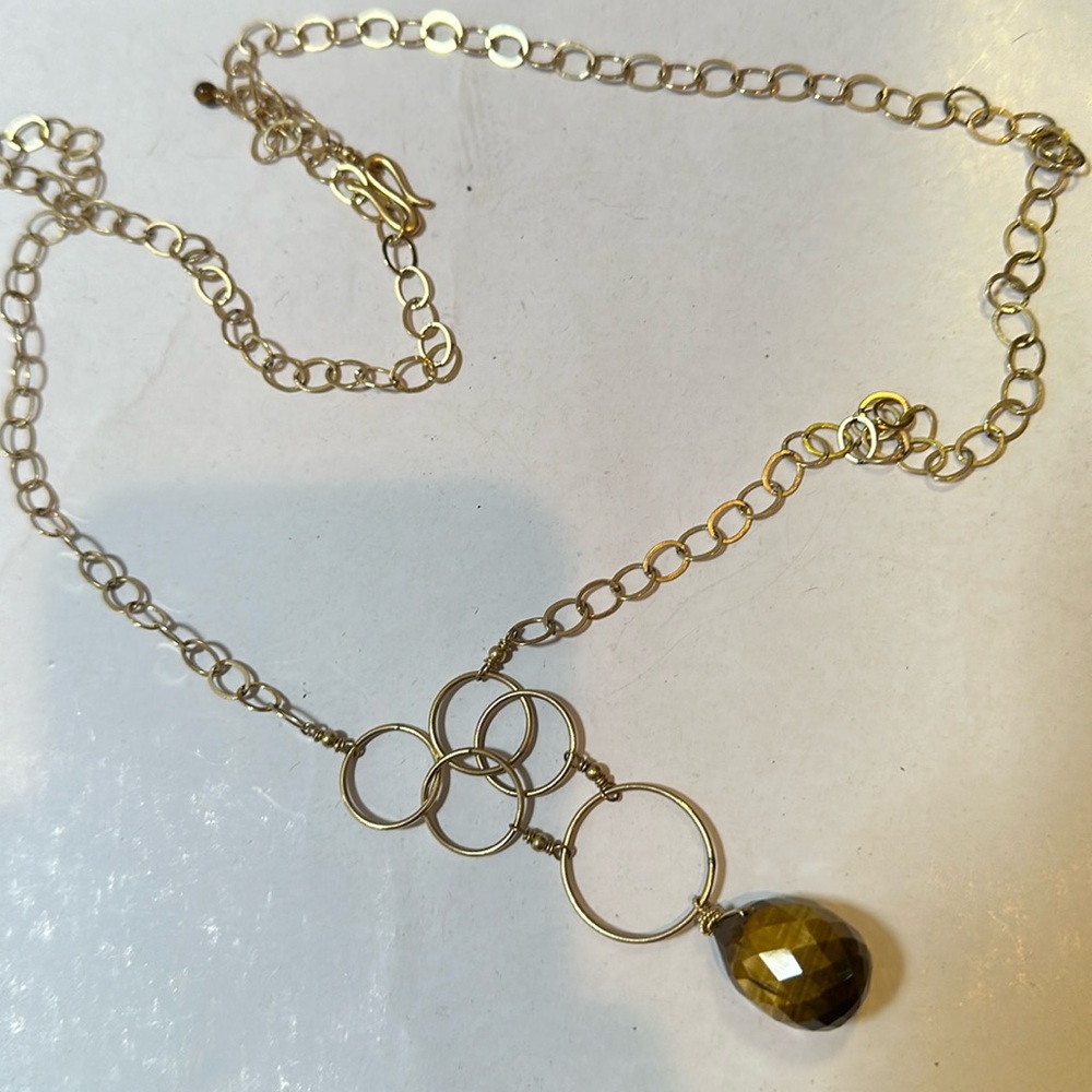 Tigers eye faceted gem on gold plated necklace